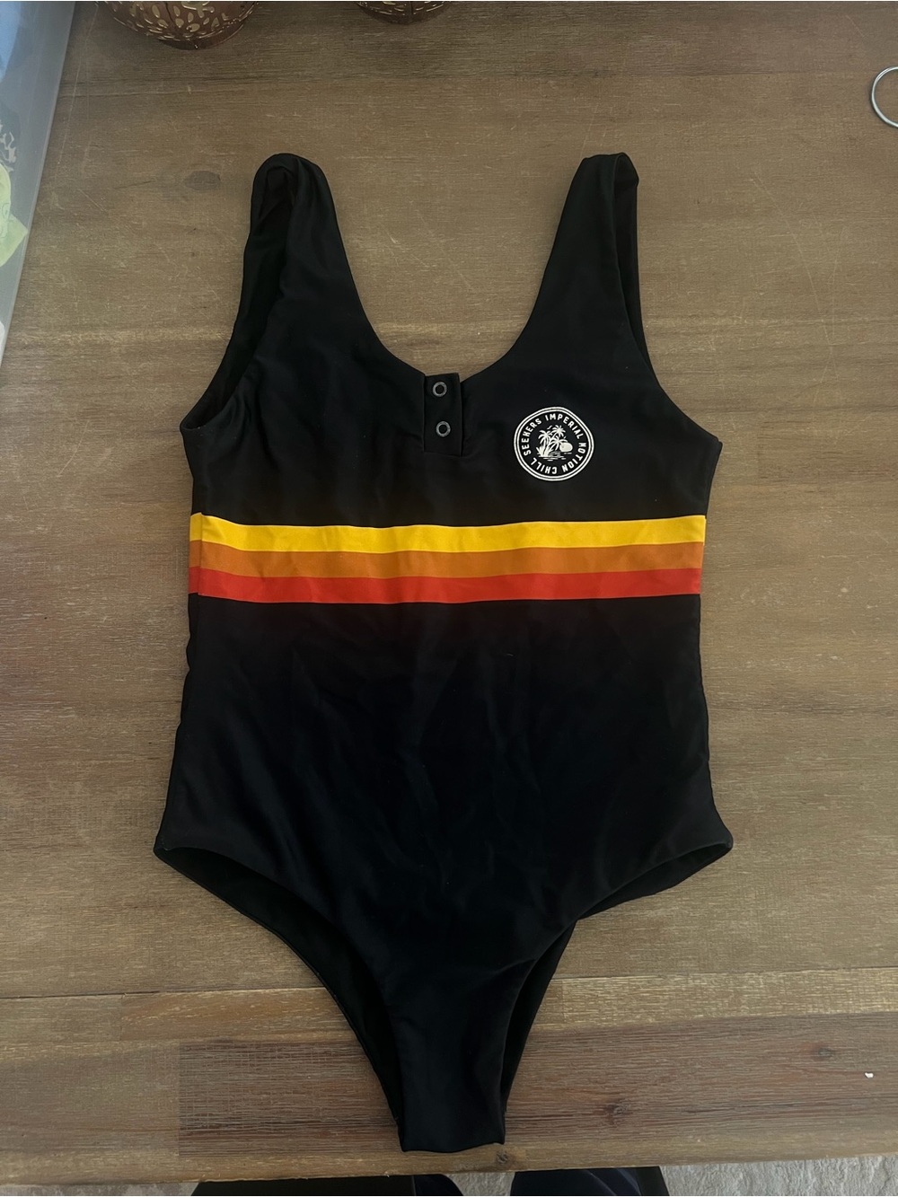 Imperial Motion Black One-Piece Swimsuit with Sunset Stripes